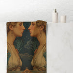 Gemini Zodiac Art bath towel draped over bathtub edge showing twin figure moonlit print, white tile bathroom