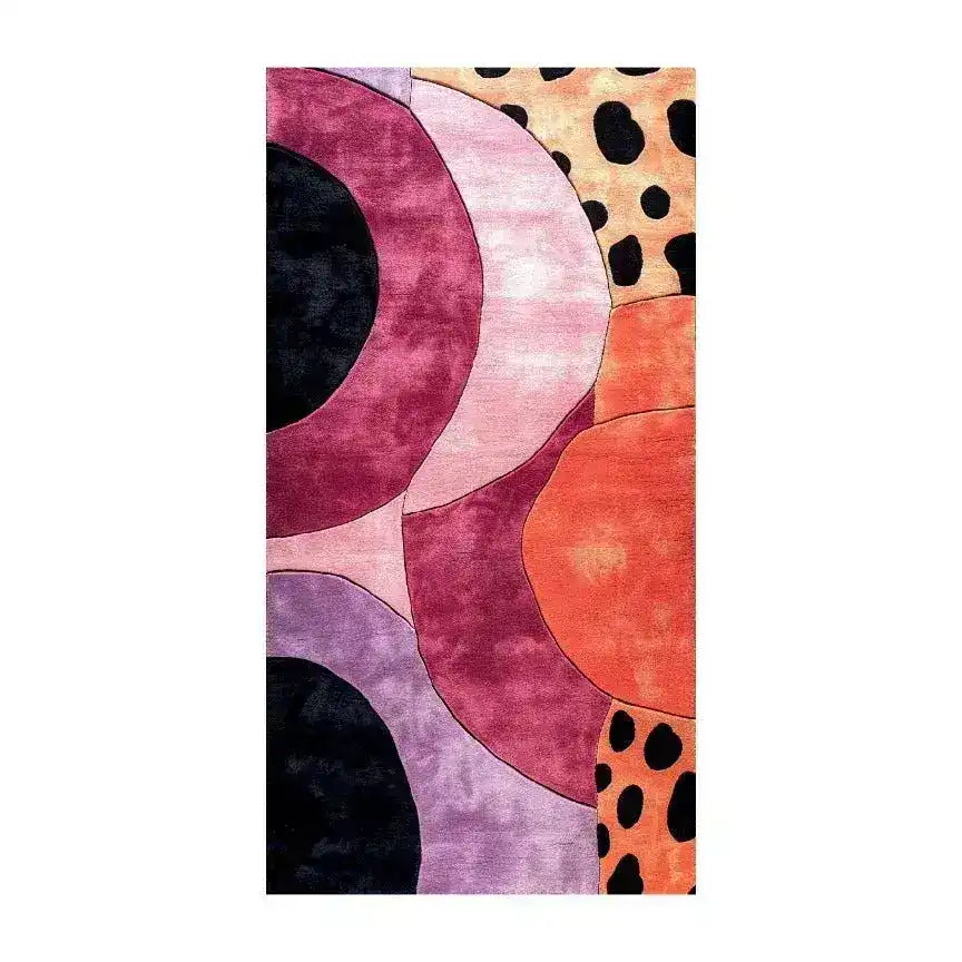A vibrant geometric animal print area rug, perfect for adding a contemporary touch to your living room, hallway, or kitchen. This hand-tufted wool rug features bold circles and abstract patterns in shades of purple, orange, and black, making it an eye-catching addition to any space. Ideal as a hallway runner rug, kitchen runner rug, or a large living room area rug.