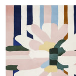 This contemporary area rug features an abstract floral design with bold geometric shapes, perfect for adding a modern touch to any living room. The hand-tufted wool rug showcases a mix of pastel and bold colors like pink, blue, and green, making it an eye-catching square area rug suitable for large spaces.