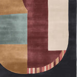 A stylish Geometric Block Harmony Hand Tufted Rug showcasing an abstract design with earthy tones and a bold mix of colors. This contemporary area rug is made of high-quality wool, perfect for enhancing the aesthetics of living room spaces. Ideal for those seeking a modern touch with a unique pattern in their living room area rugs.