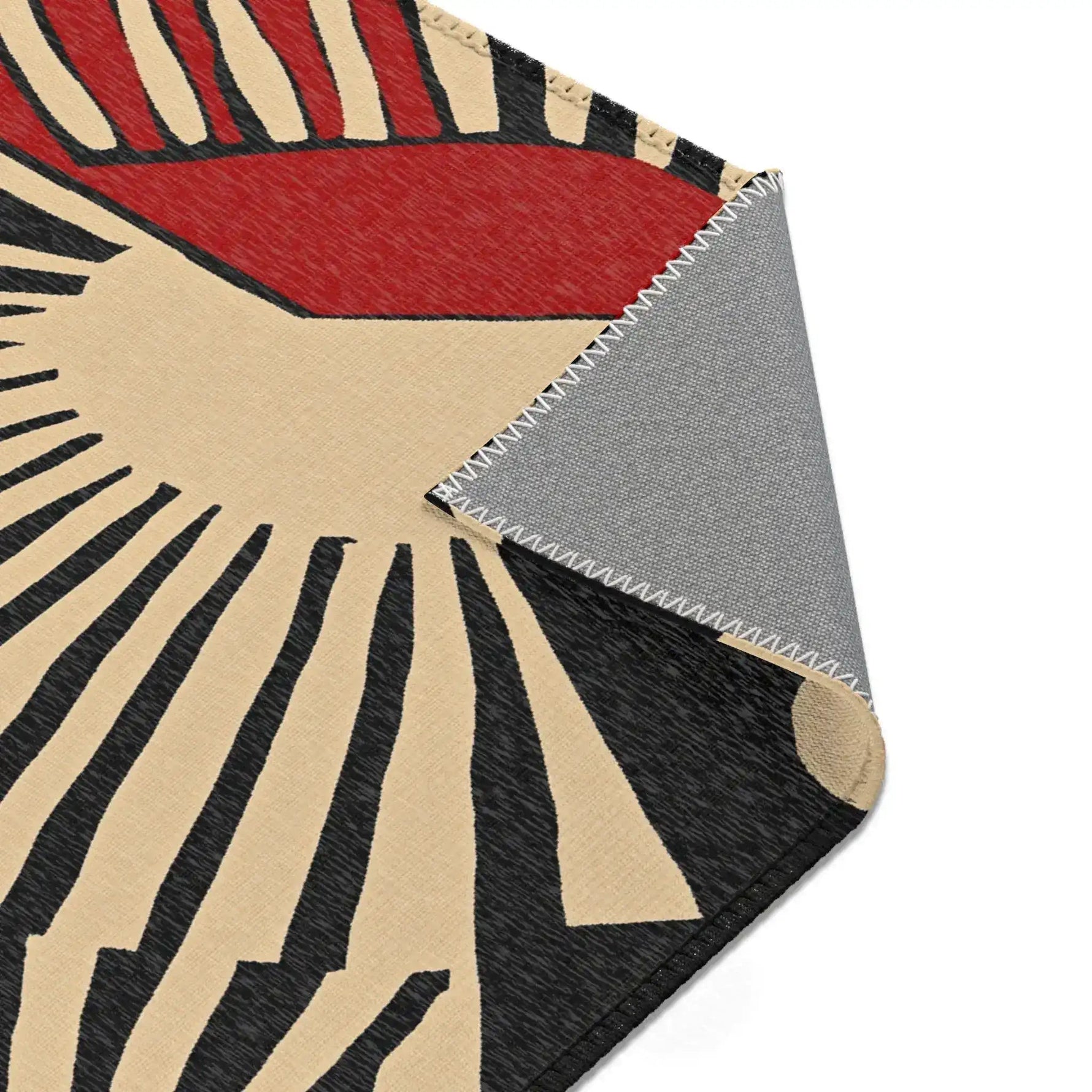 Jigsaw puzzle partially assembled on marble surface with white box showing maximalist room art on Geometric Sunburst Accent Rug