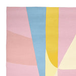 A vibrant area rug featuring an abstract design in pastel colors including pink, blue, and yellow. This wool rug is perfect for adding a contemporary touch to living room area rugs, making it an ideal choice for modern interiors.