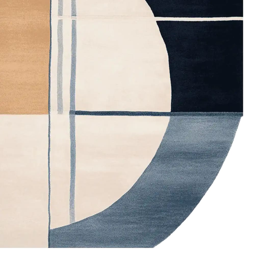 Close-up of a contemporary area rug featuring an abstract geometric design in shades of blue, beige, and cream. This wool rug is perfect for large living rooms, adding a touch of modern elegance to any space. Ideal for those seeking stylish rugs for living room decor.
