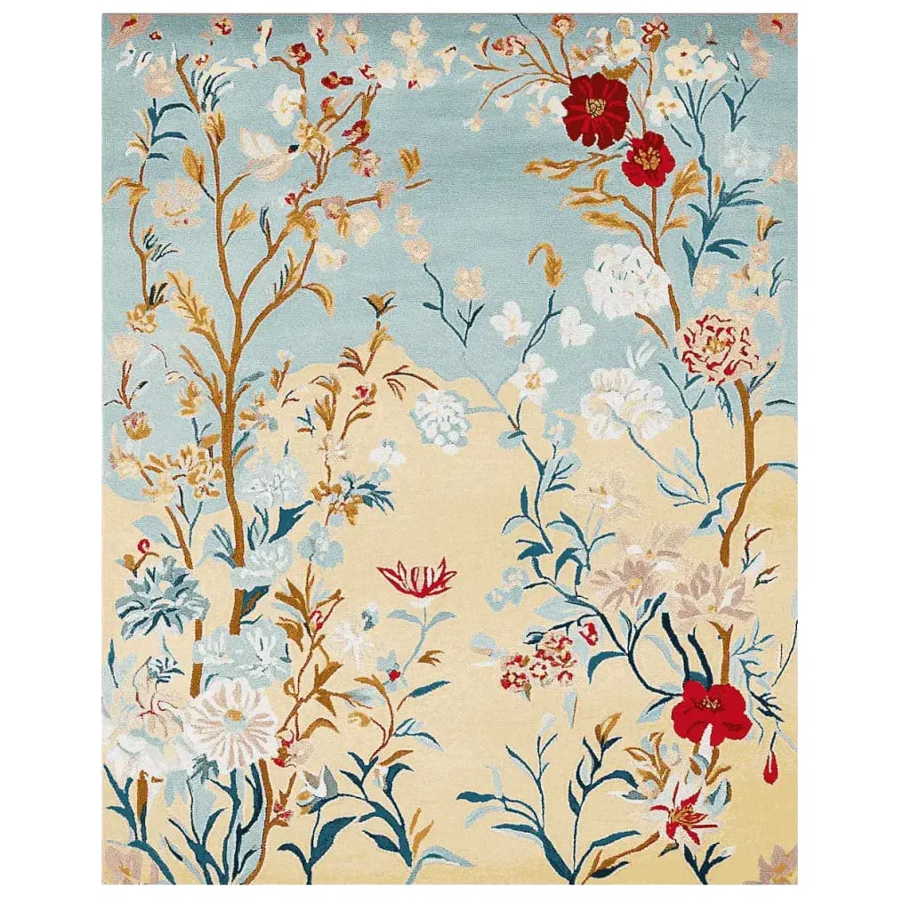 The Gilded Bloom Breeze Hand Tufted Area Rug features a vibrant floral design with intricate patterns in red, blue, and gold hues. Perfect as a wool rug, it adds elegance to large living room spaces.