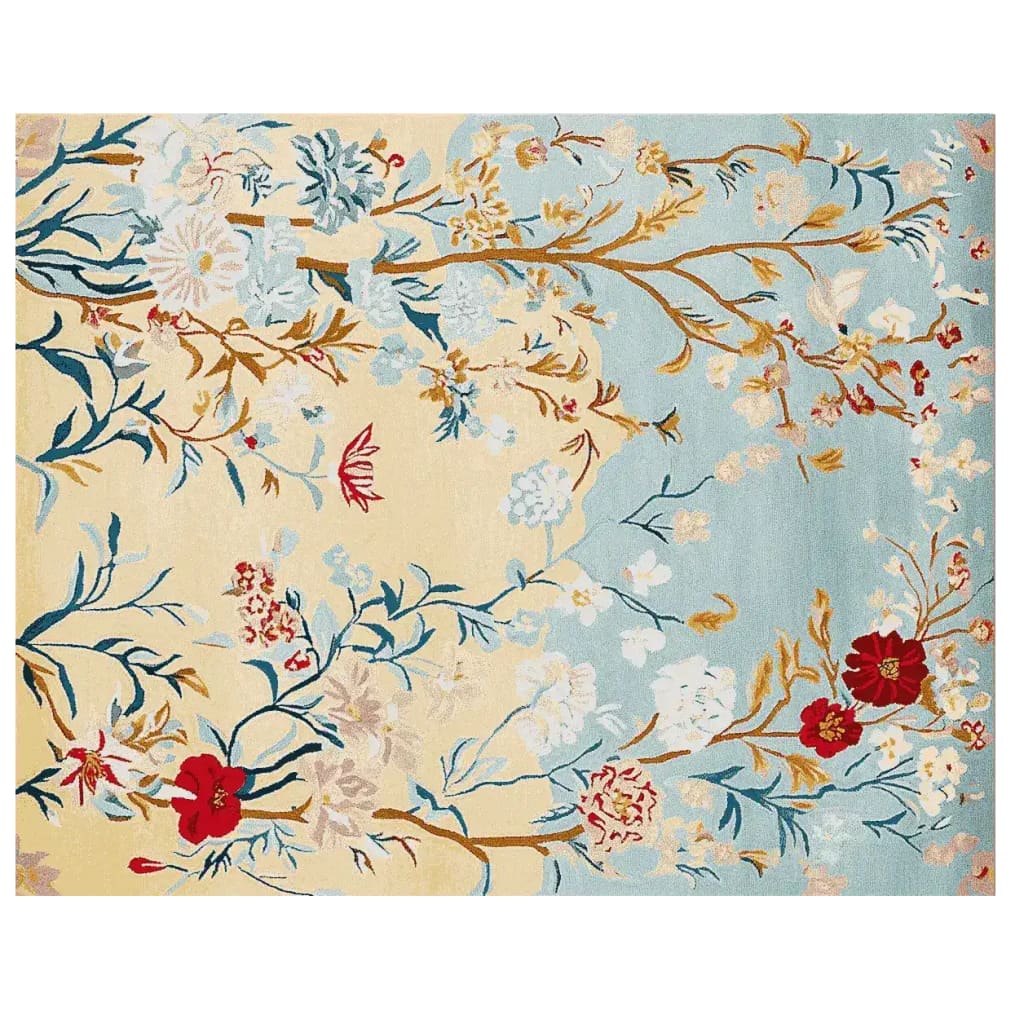 Top view of a Gilded Bloom Breeze Hand Tufted Area Rug, showcasing an elegant floral design with vibrant red and white blossoms on a background of soft blue and beige hues. This wool rug adds a touch of sophistication to large living room spaces.