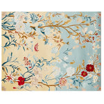 Top view of a Gilded Bloom Breeze Hand Tufted Area Rug, showcasing an elegant floral design with vibrant red and white blossoms on a background of soft blue and beige hues. This wool rug adds a touch of sophistication to large living room spaces.