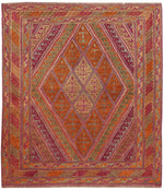 Vibrant hand-knotted area rug featuring intricate geometric patterns in shades of orange, pink, and gold. Perfect for adding a touch of elegance to your living space, this rug is ideal for those seeking stylish rugs for living room. Its 8x10 size makes it a great fit for larger spaces.