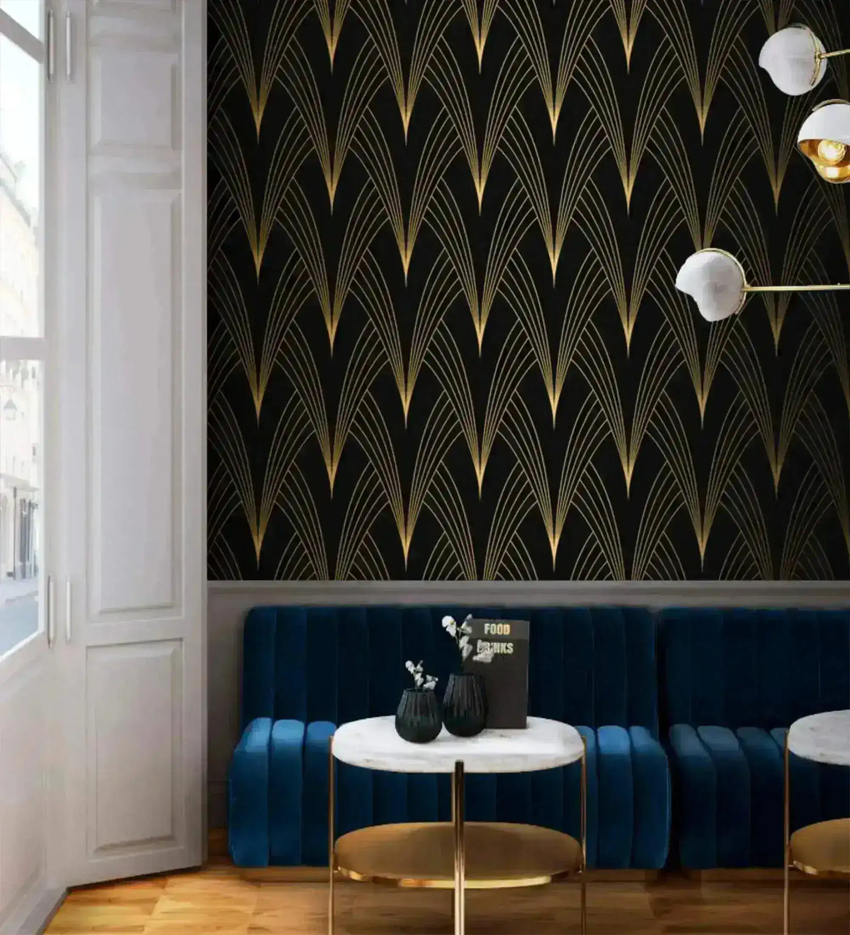 Gilded Grandeur Art Deco wallpaper in bar setting; gold fan lines on black, navy tufted banquette, marble café table