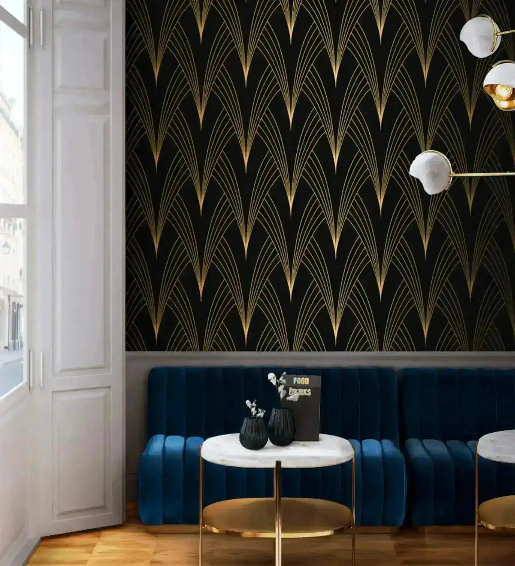 Gilded Grandeur Art Deco wallpaper in bar setting; gold fan lines on black, navy tufted banquette, marble café table