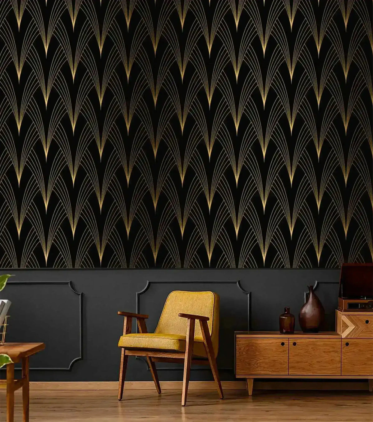 Art Deco Noir wallpaper with gold fan motif on black above dark grey paneling; yellow armchair and walnut sideboard