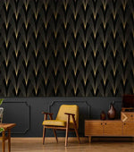 Art Deco Noir wallpaper with gold fan motif on black above dark grey paneling; yellow armchair and walnut sideboard