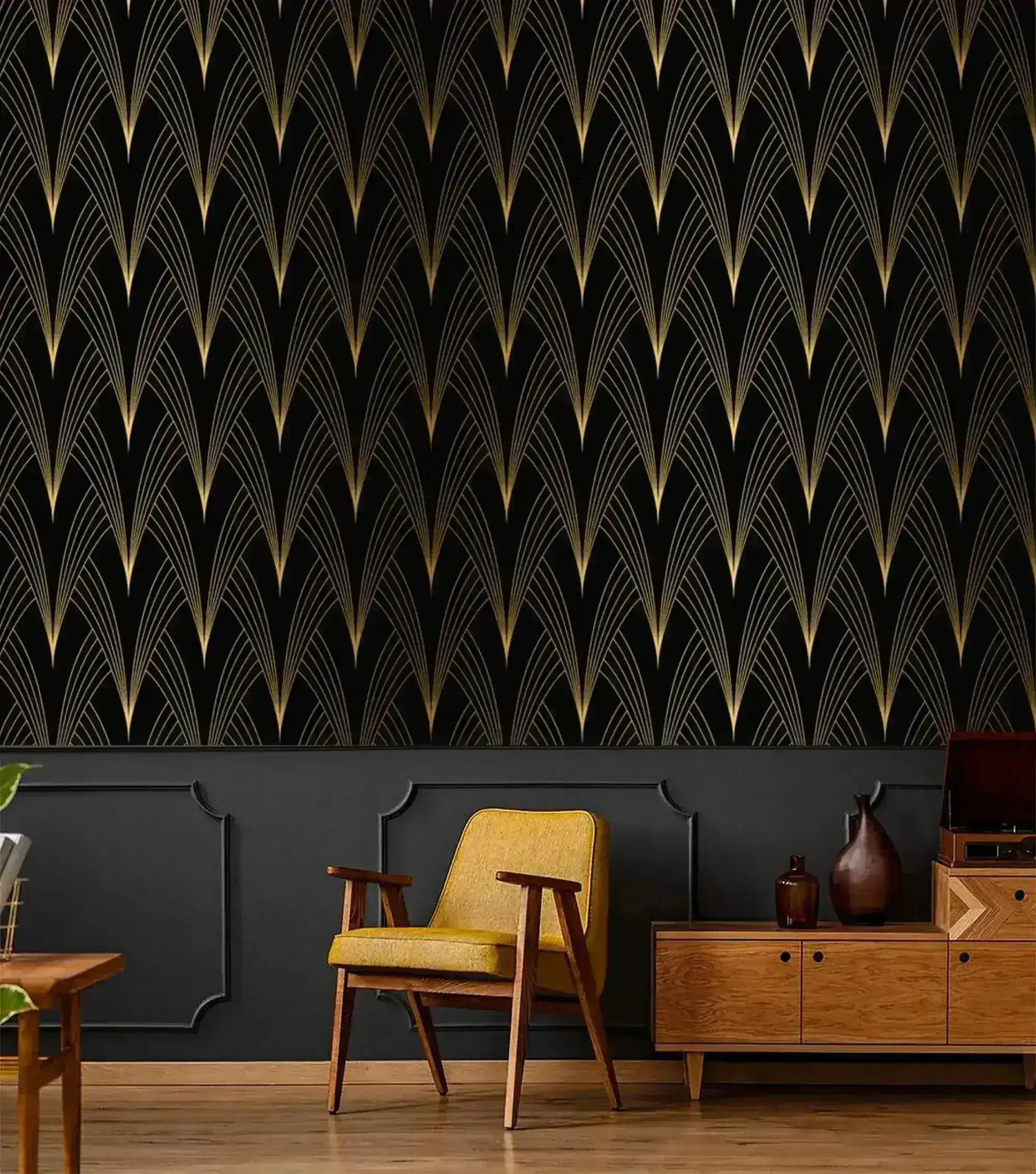 Art Deco Noir wallpaper with gold fan motif on black above dark grey paneling; yellow armchair and walnut sideboard