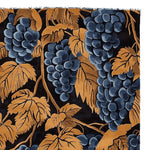 Close-up view of the Gilded Grapes Hand Tufted Rug, featuring a rich and detailed grapevine pattern in deep blues and warm golds. This luxurious area rug, made from high-quality wool, is perfect for adding a touch of vintage elegance to your living room. Sized ideally for living room rugs 8x10, this large wool rug blends classic design with modern comfort.