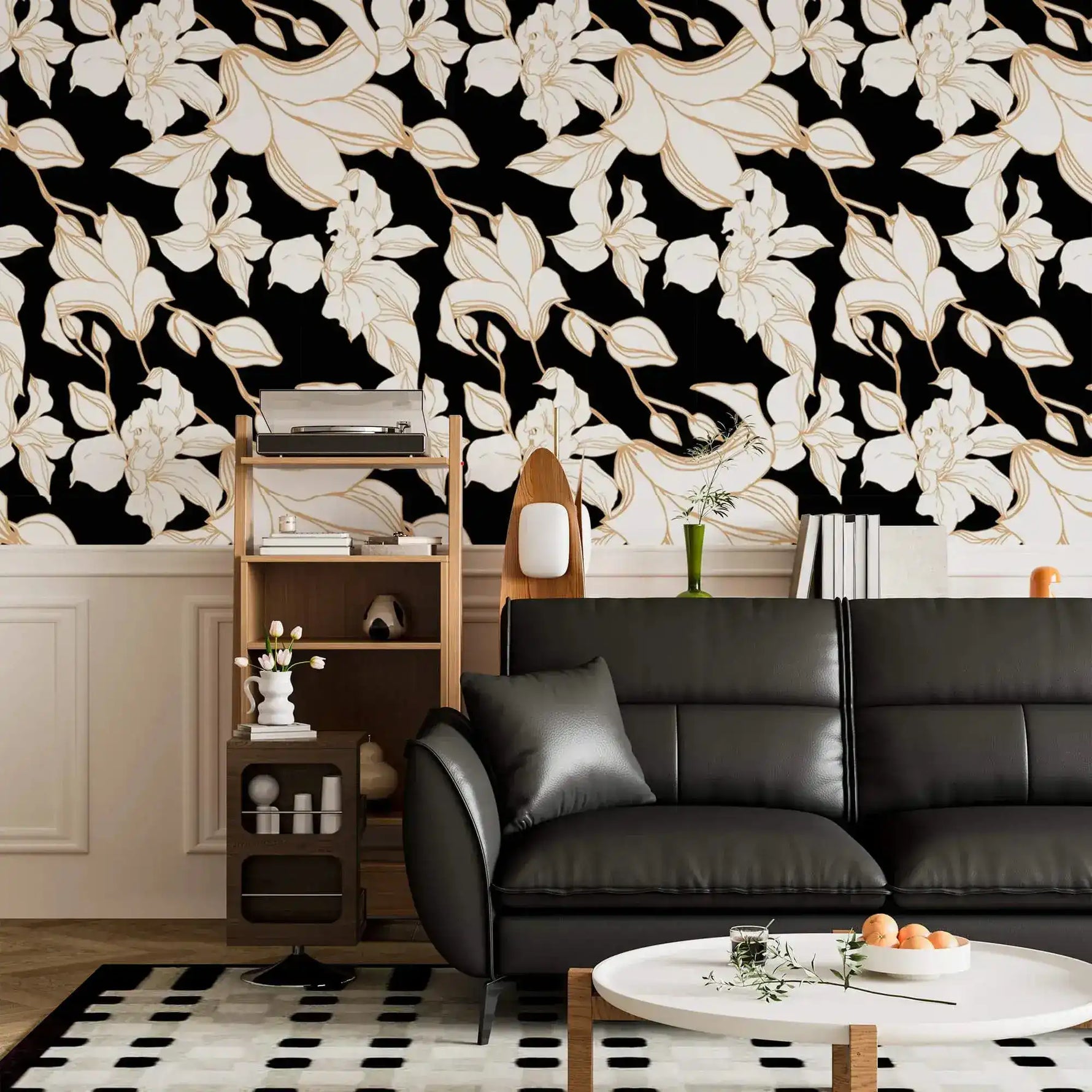 Gilded Petal wallpaper above black leather sofa in living room; cream gold-edged floral pattern on black with wood shelving