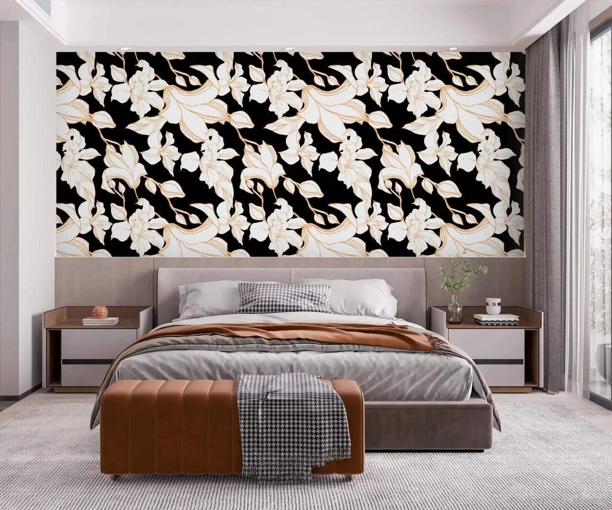 Gilded Petal wallpaper as headboard accent wall in modern bedroom; white gold-edged florals on black background