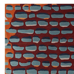 Contemporary area rug in an abstract pattern of blue and orange shapes on a deep red background. Perfect wool rug for living room settings, sized 8x10, adding a modern touch to your decor.