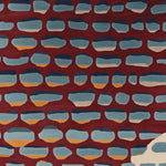 A vibrant area rug featuring a contemporary design with abstract blue and orange shapes on a rich red background. This hand-tufted wool rug is perfect for adding a splash of color to living room spaces, especially in an 8x10 size. Ideal for those seeking unique and stylish rugs for living rooms.