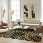 Modern living room with a beige sofa, armchairs, an abstract wool rug, and abstract art on the wall.