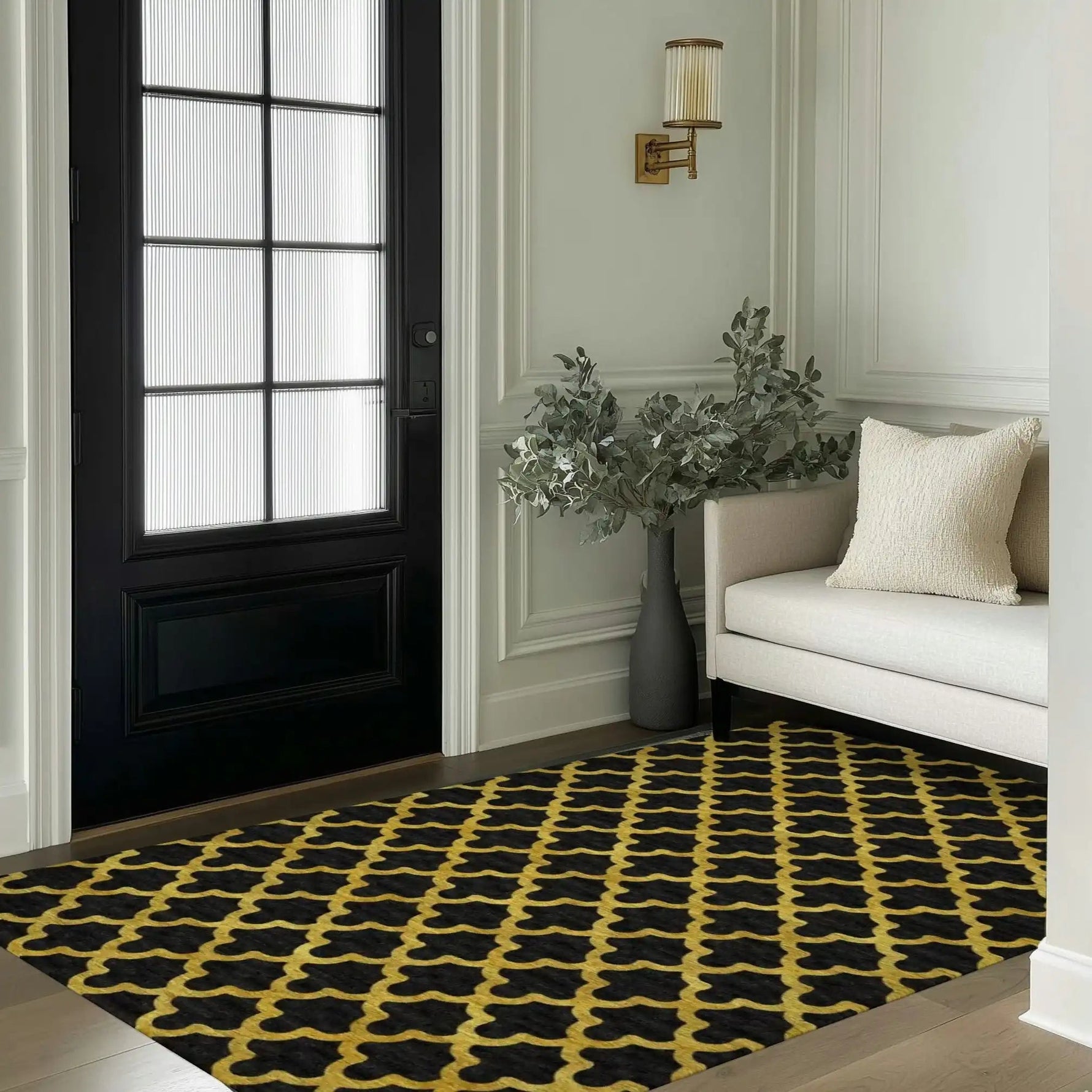 This elegant area rug features a golden Art Deco scale pattern on a black tufted wool surface, perfectly complementing the sophisticated decor of a living room. Positioned in a stylish entryway, the rug adds a touch of luxury and warmth to the space, making it ideal for bedrooms or living room area rugs.