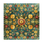 A stunning Golden Blossom Persian hand-tufted area rug featuring intricate floral patterns in vibrant colors on a rich teal background. This large wool rug is perfect for adding a vintage touch to your living room or dining room. Its square shape and detailed designs make it an ideal choice for those seeking elegant Persian rugs.