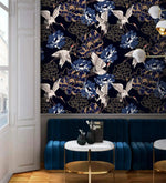 Golden crane flight wallpaper above blue velvet banquette, white cranes and blue peonies on navy