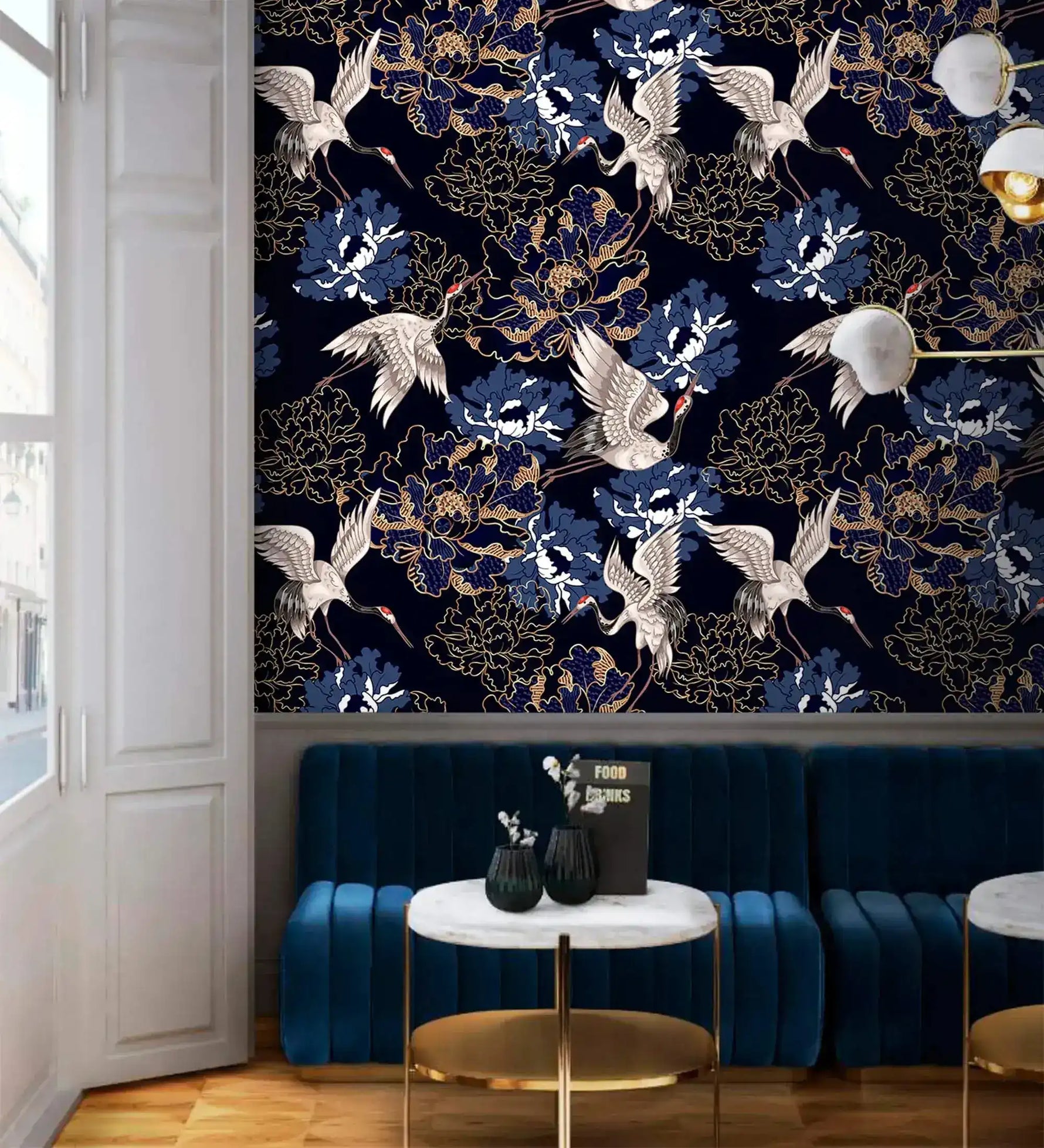 Golden crane flight wallpaper above blue velvet banquette, white cranes and blue peonies on navy
