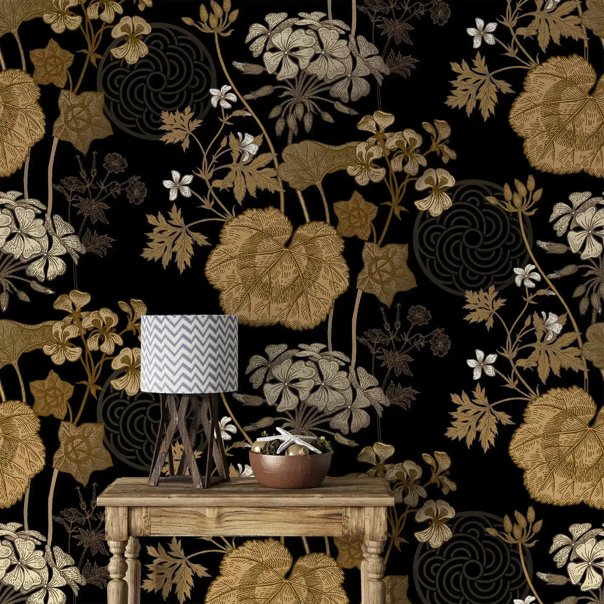 Console table with lamp against golden creeper vine wallpaper, gold blooms on black
