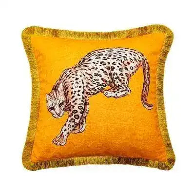 Golden fringe leopard throw pillow cover featuring a playful leopard design on a vibrant orange background.