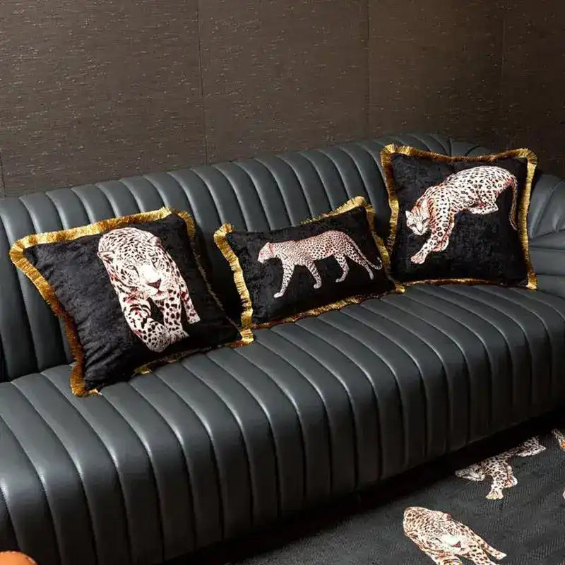 Golden fringe leopard throw pillow cover displayed on a modern sofa, featuring intricate leopard designs.