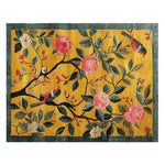 Golden Garden Bloom Hand Tufted Area Rug featuring a vibrant floral design with pink and cream blossoms and green leaves on a rich golden background. This wool rug adds a touch of nature-inspired elegance to any large living room, embodying a contemporary style perfect for rugs in living rooms.