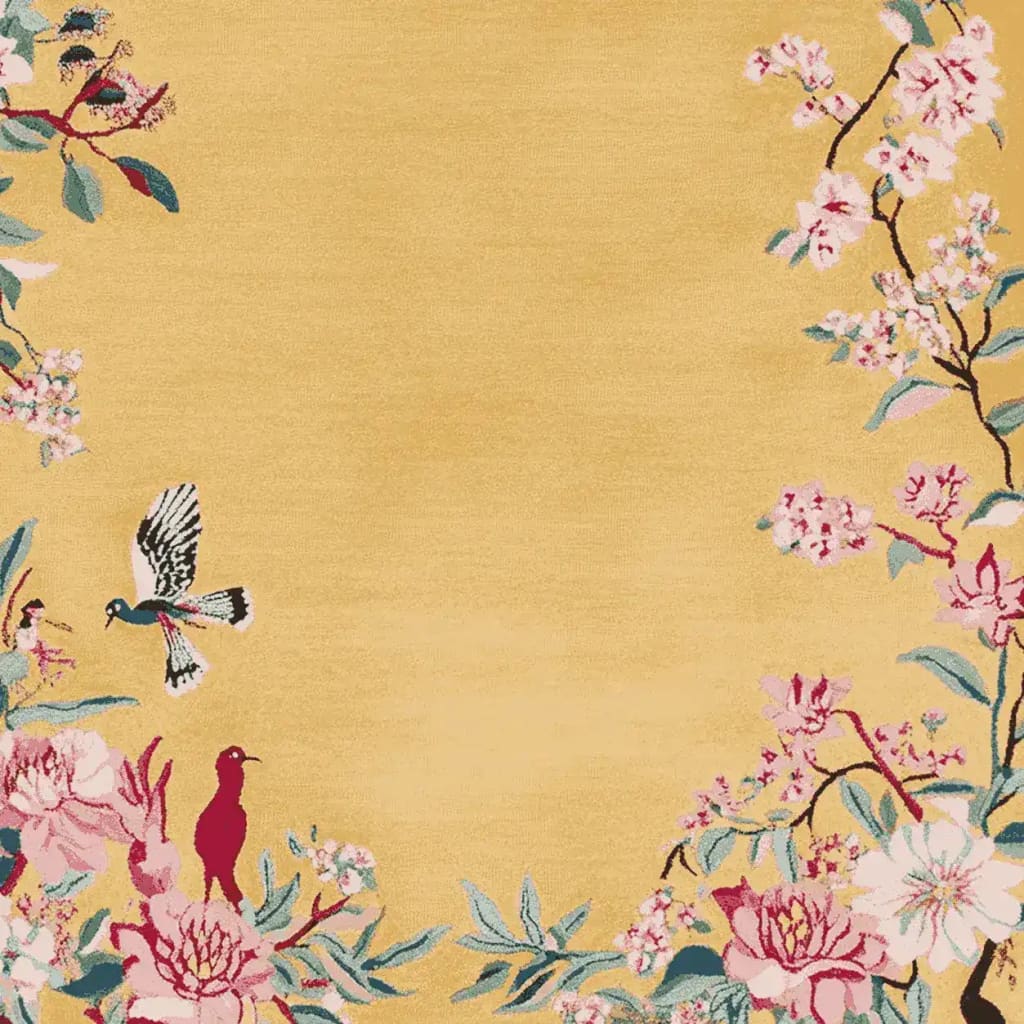 Golden Garden Flight Hand Tufted Area Rug showcasing a vibrant design with a golden-yellow background, adorned with intricate floral and bird patterns. This wool rug is perfect for adding a touch of elegance to living room areas, making it an ideal choice for rugs for living rooms.
