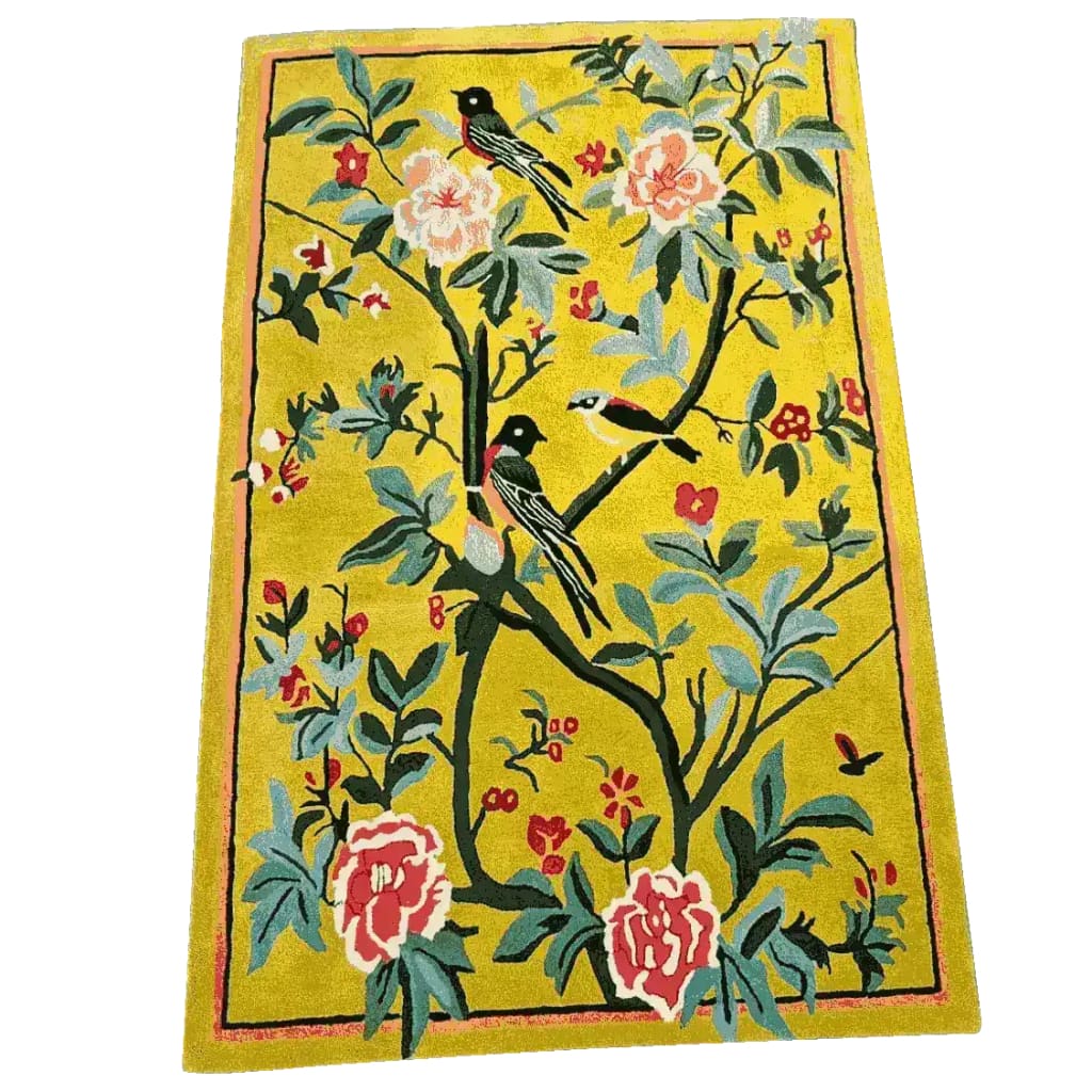 Vibrant Golden Garden Hand Tufted Area Rug measuring 5' x 8'. This wool rug features an intricate floral design with colorful birds perched on branches, perfect for enhancing dining room decor. The lively floral pattern makes it an ideal choice for living room area rugs, adding a touch of elegance and warmth.