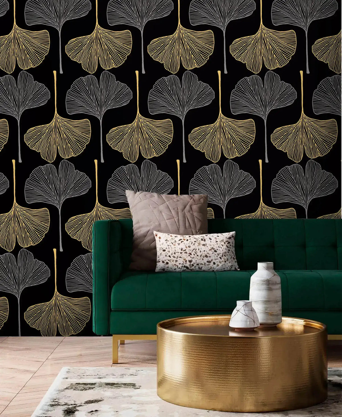 Golden Gingko Grove Wallpaper in black and gold behind an emerald sofa and brass table