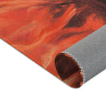 Swirling red-orange brushstroke jacket print corner of the Golden Majesty Luxe Lion Accent Rug curled back to reveal grey anti-slip backing
