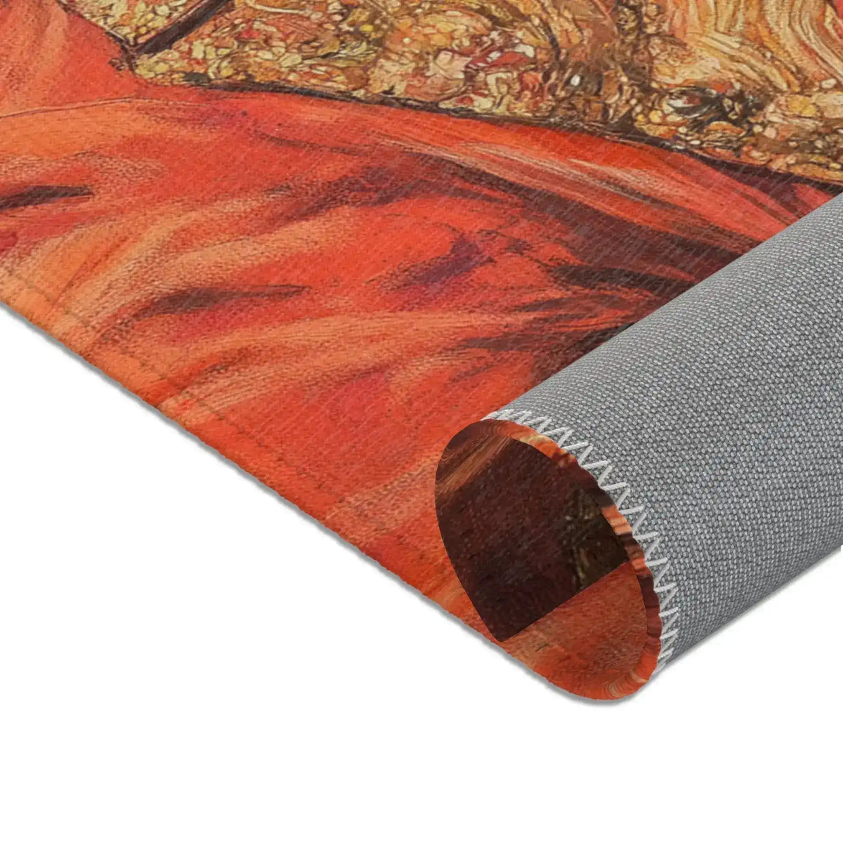 Corner of the Golden Majesty Luxe Lion Accent Rug rolled back revealing grey non-slip backing with red-orange baroque lion portrait print