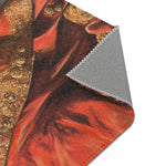 Folded corner of the Golden Majesty Luxe Lion Accent Rug exposing grey backing, red-orange lion jacket print with gold embroidery detail