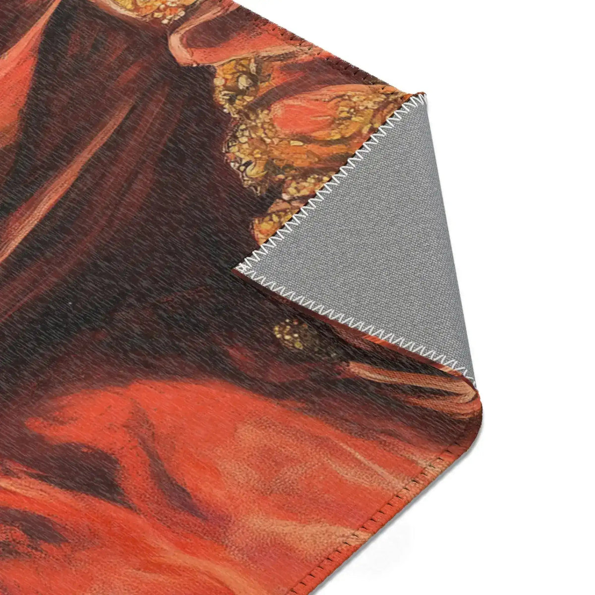 Dark red baroque jacket body print with gold ornamental trim on corner fold of the Golden Majesty Luxe Lion Accent Rug, grey backing visible