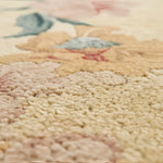 Close-up of a textured rug with floral patterns