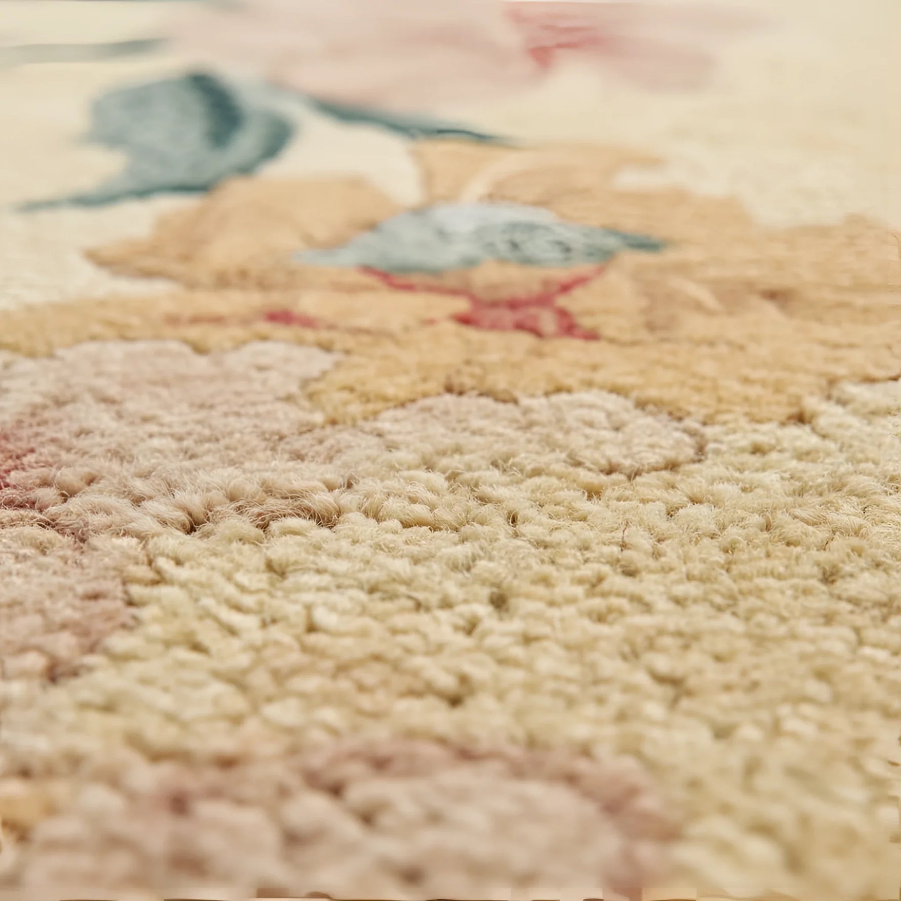 Close-up of a textured rug with floral patterns