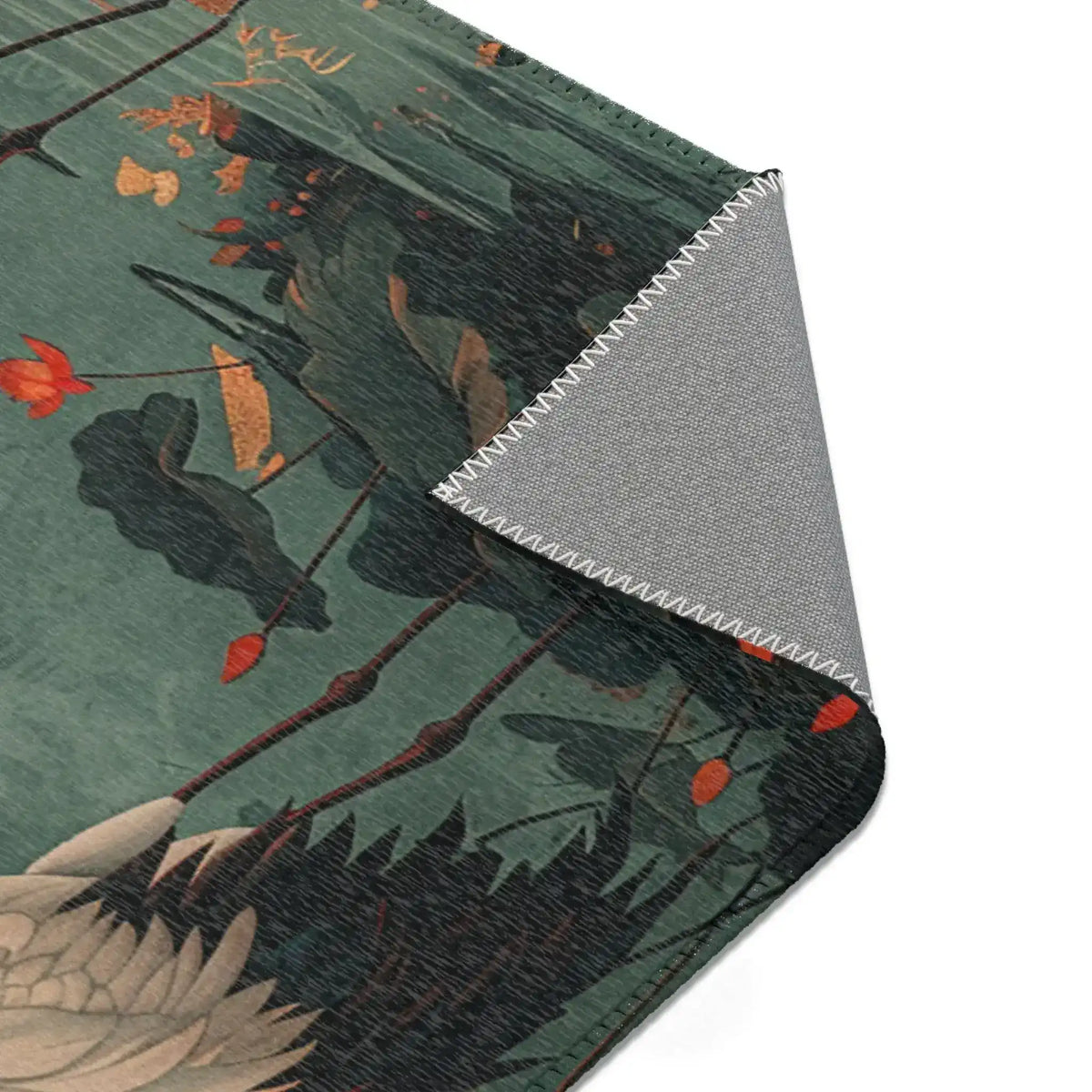 Golden Moon and Crane Harmony Rug corner fold revealing grey backing with crane and lotus waterscape design visible