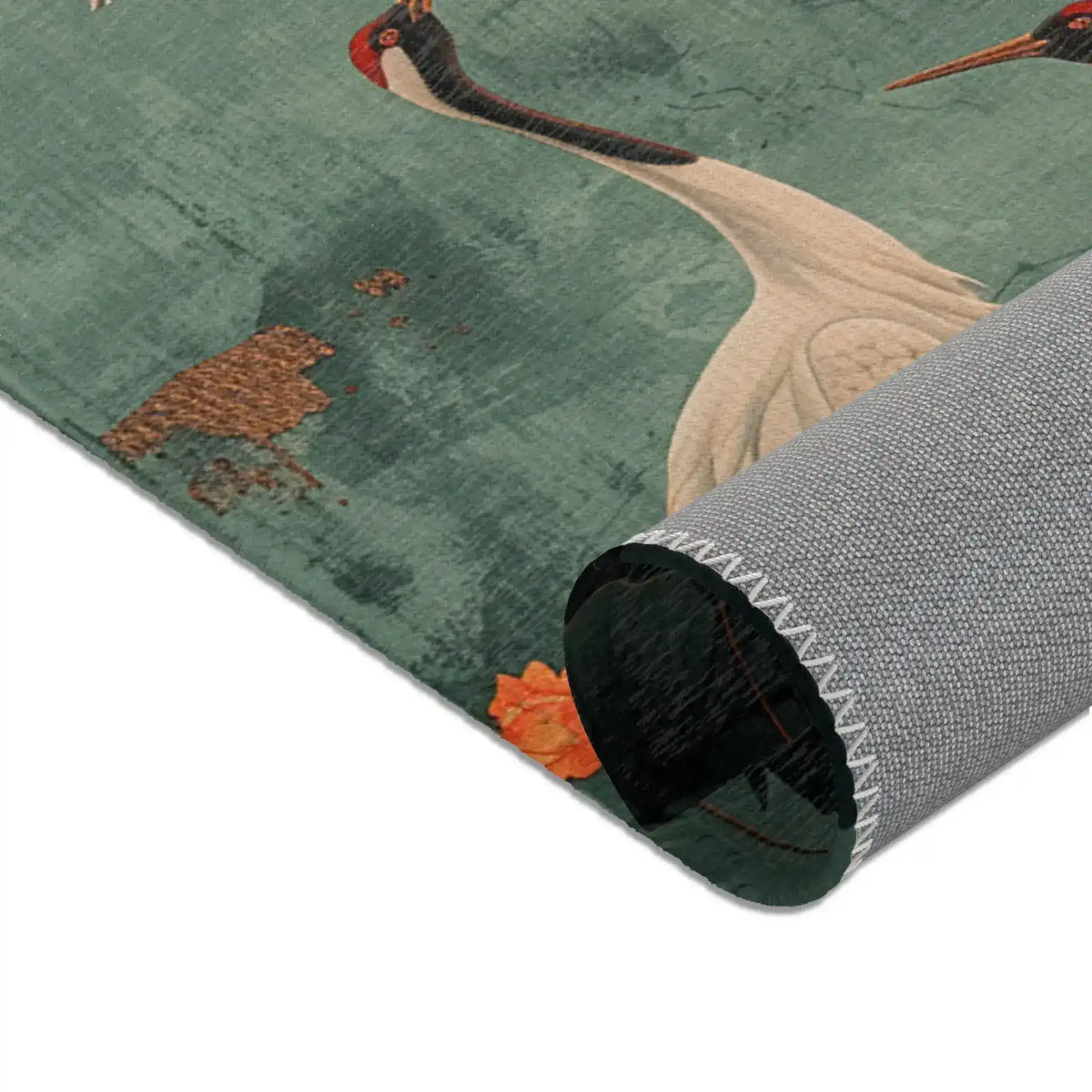 Golden Moon and Crane Harmony Rug rolled corner detail showing teal crane pattern and grey non-slip backing