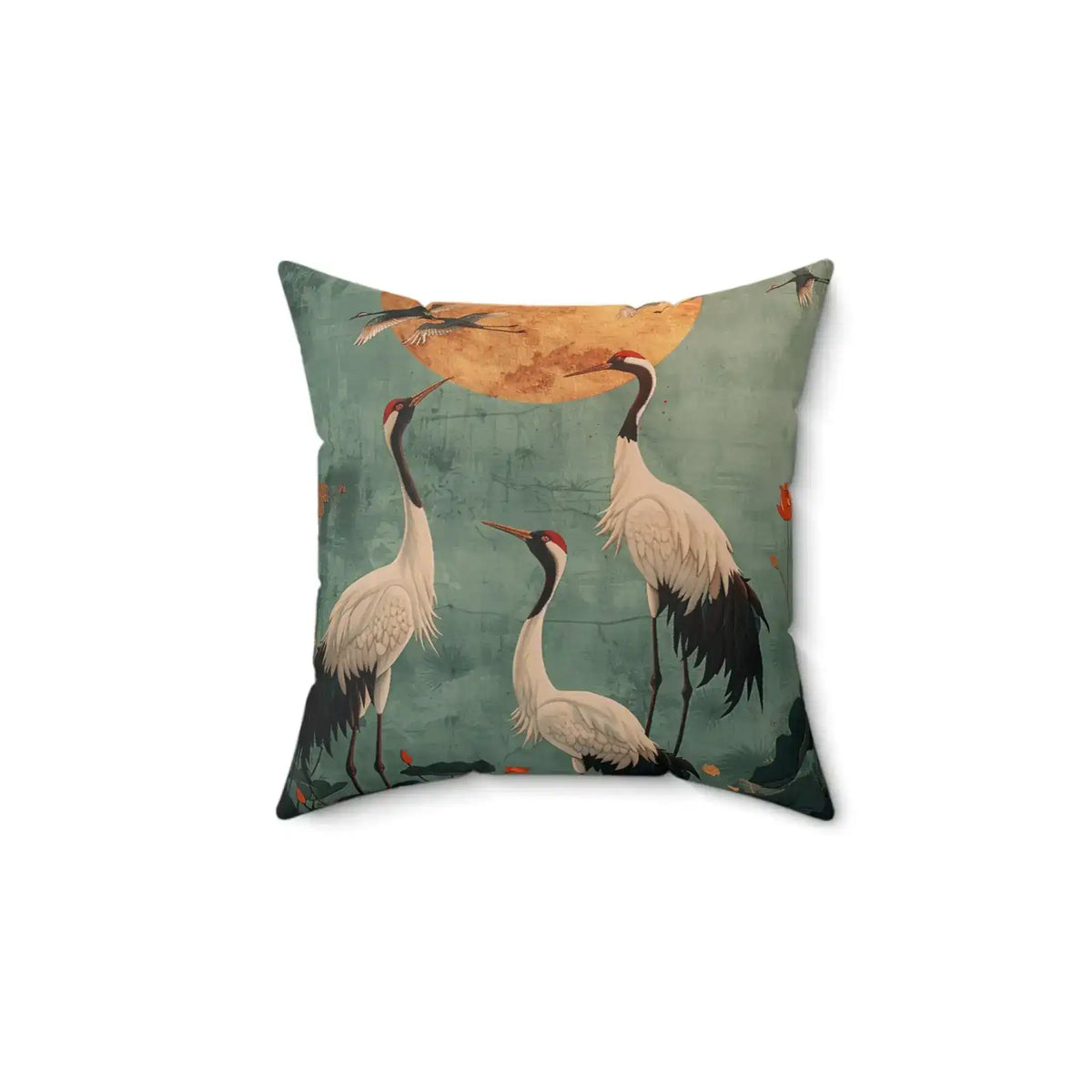 Square throw pillow with teal-blue distressed background showing three white Japanese cranes with red-capped heads beneath a large golden moon — Golden Moon & Crane Serenity Pillow front