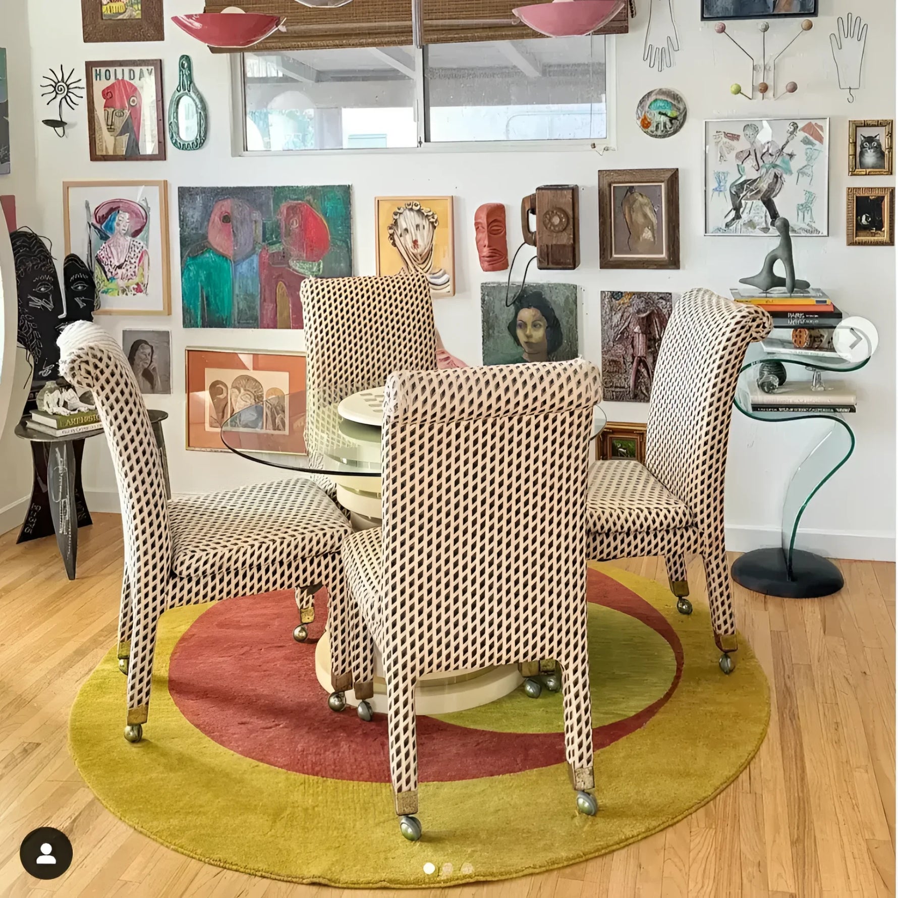 A stylish room featuring a Golden Orange Geometry Round Hand Knotted Wool Rug, perfect for adding warmth and elegance to any bedroom or living room. The area rug complements the room's eclectic decor with its vibrant colors and unique design, making it an ideal choice for bedroom rugs or area rugs for the living room.