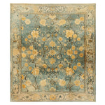 Top view of the Golden Petals Hand Tufted Wool Rug, an elegant area rug featuring intricate vintage floral patterns in warm gold and blue hues. Perfect for adding a touch of sophistication to living room spaces, this 8x10 wool rug enhances any decor with its timeless design.