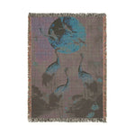 Corner fold of navy floral blanket showing orange and pink blooms detail, grey non-slip backing on Golden Serenity product