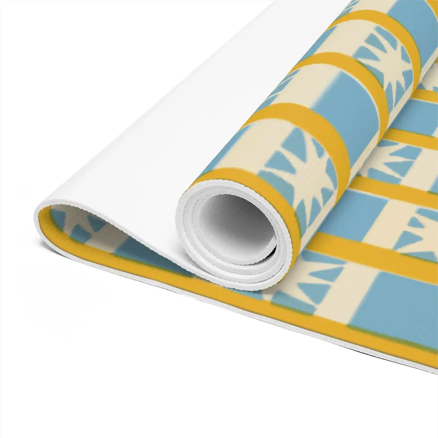 Rolled-up Golden Solstice yoga mat close-up, blue and cream star-check print with gold accents