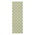Golden solstice yoga mat in a blue, cream and gold checkered grid with starburst squares