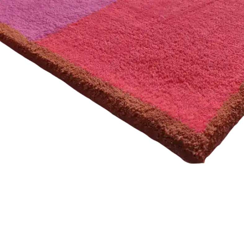 Close-up view of the Golden Trim Minimalist Geometric Hand Tufted Area Rug in pink, highlighting the plush wool texture and vibrant colors. Perfect as a living room rug in 8x10 size, this vintage-inspired piece adds a modern touch to your decor.