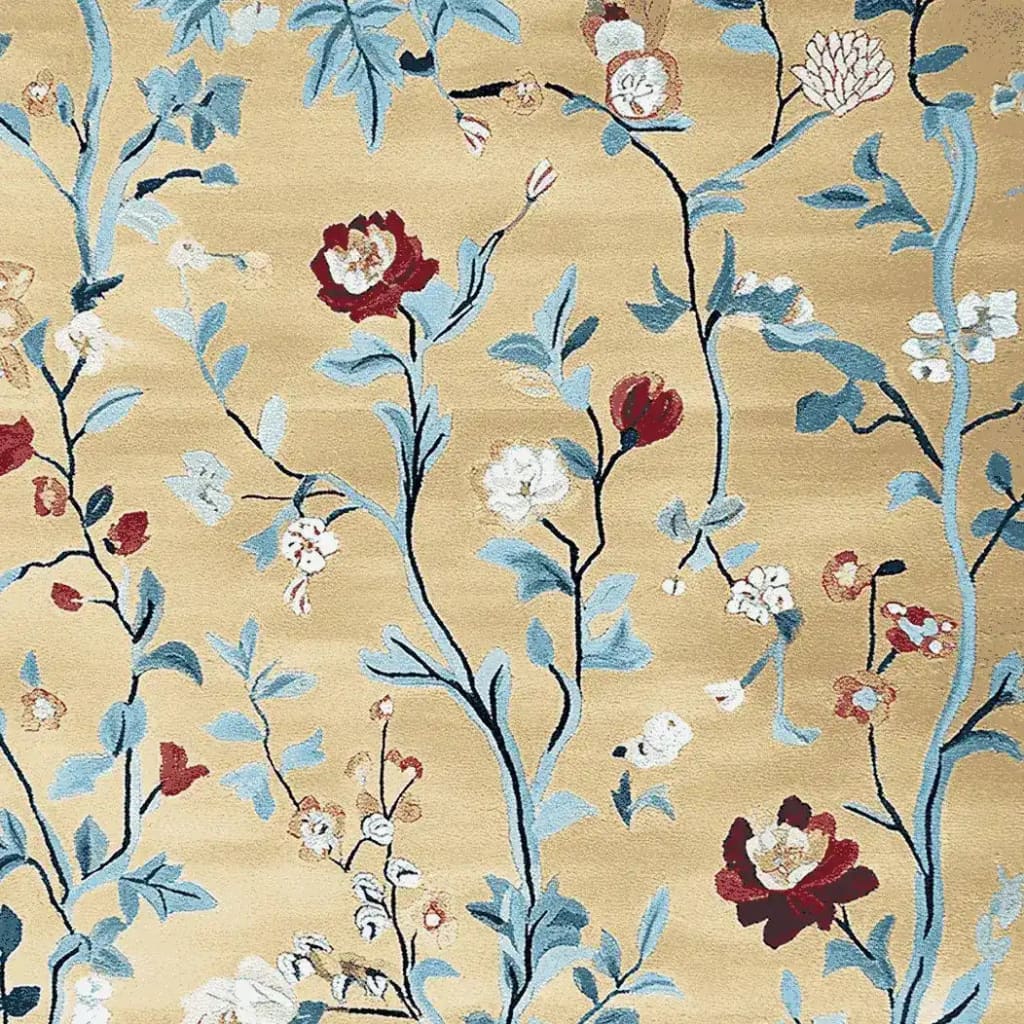 Elegant Golden Vine Rhapsody Hand Tufted Area Rug showcasing intricate floral patterns with blue, red, and white flowers on a soft golden wool background. Perfect for adding a touch of nature to large living room spaces, this wool rug blends artistic design with comfort.