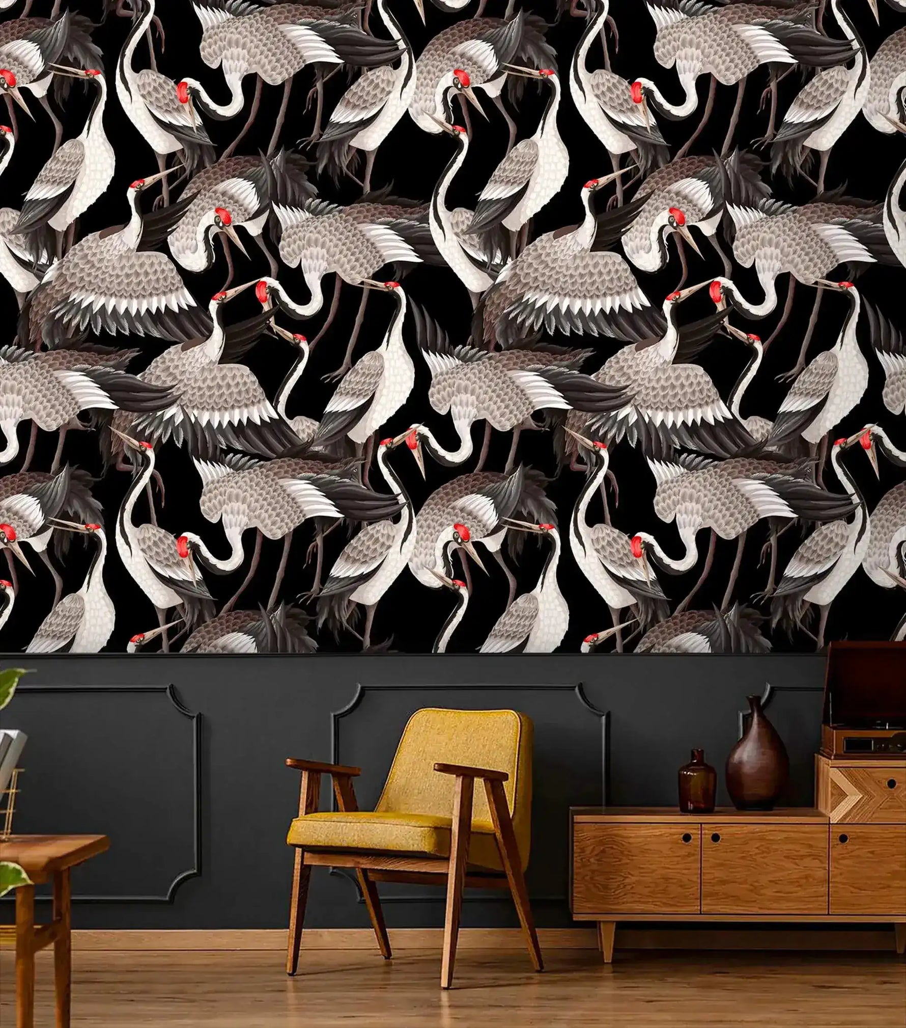 Graceful Crane Haven Wallpaper in black with grey cranes over a tan ottoman and credenza